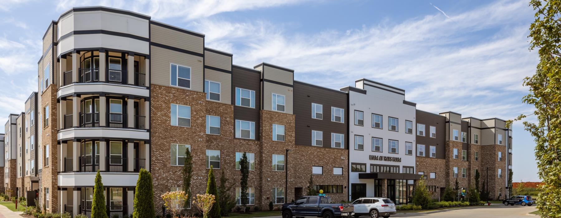a building with cars parked in front