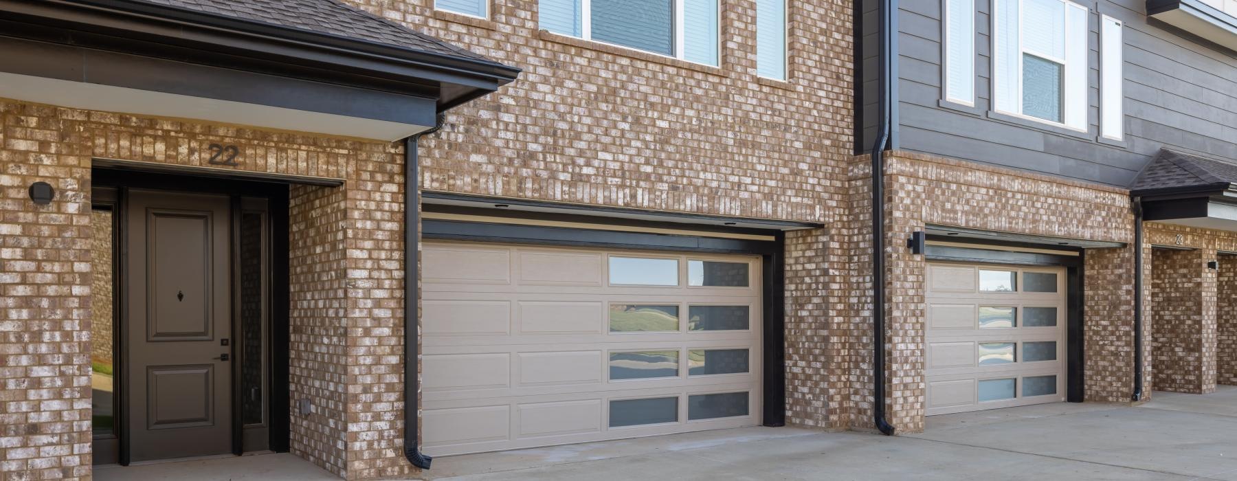 a brick building with garages on the front